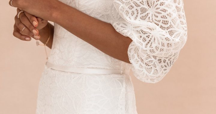 a bride wearing a lovely lace ballet-style wedding dress with puffy sleeves