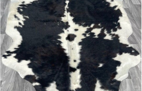 A Black and White Cowhide Rug.