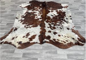 Brown and White Cowhide Rug.