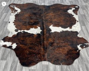 White and Brown Cowhide Rug.
